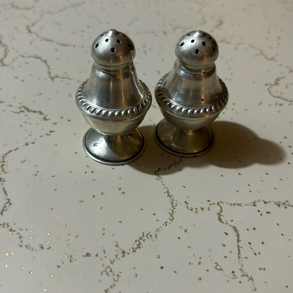 Sliver salt and pepper shakers. 2”